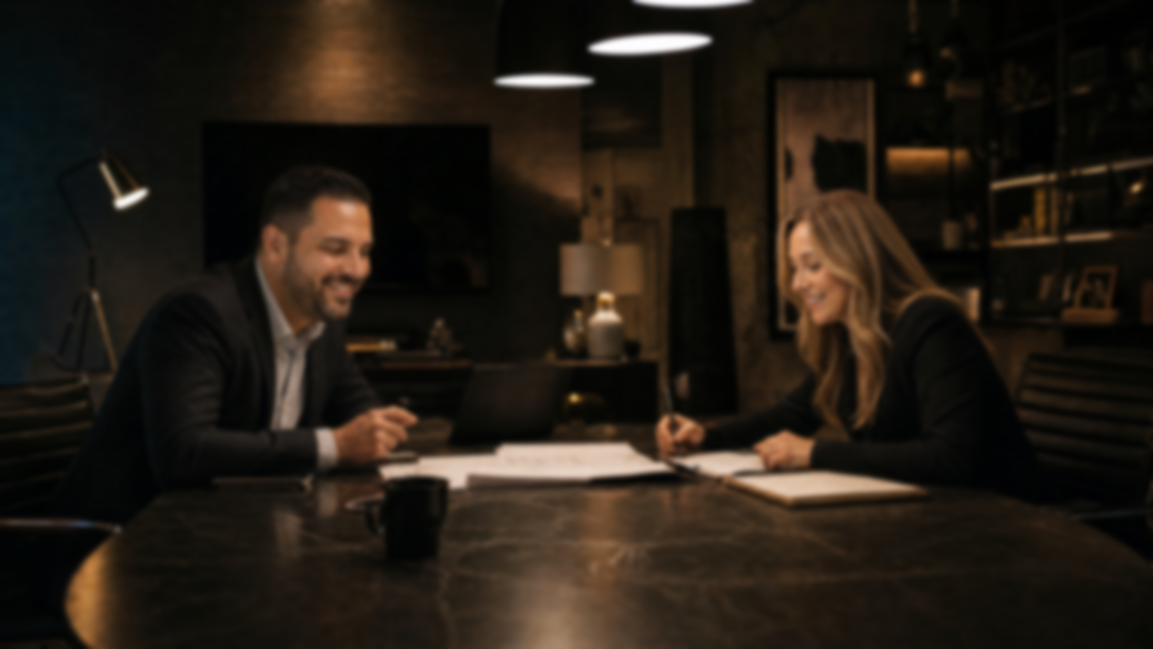 Rob and Amanda working together at a conference table
